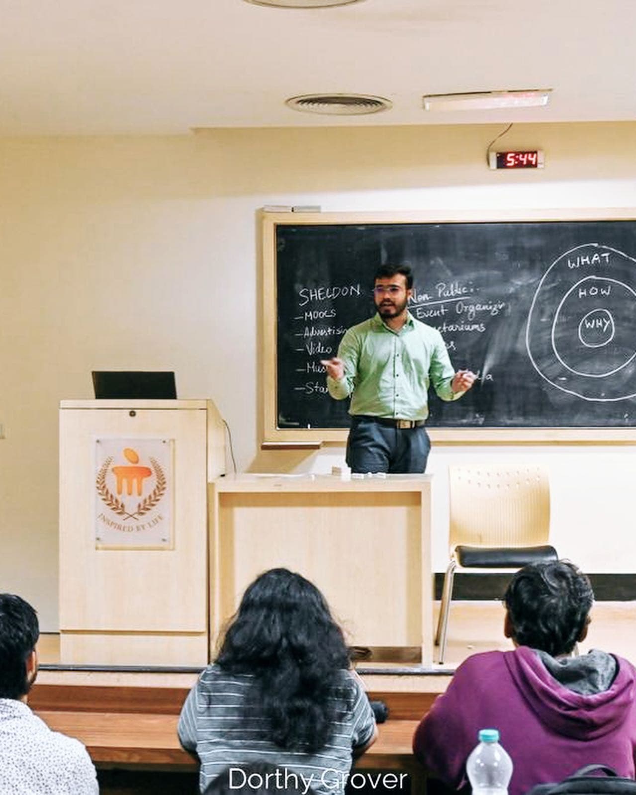 Kshitij explaining physics at a chalkboard